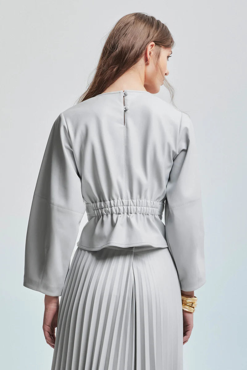 Kocca blusa corta in ecopelle